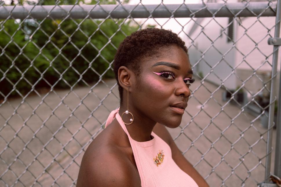 Free Image of Close-up of woman with pink highlight 
