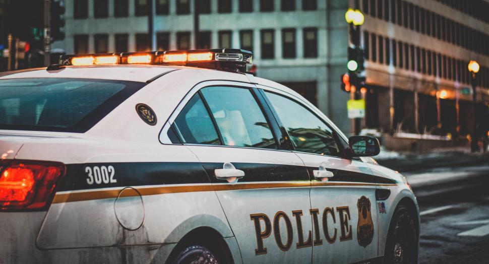 Free Image of Parked police car with lights on 