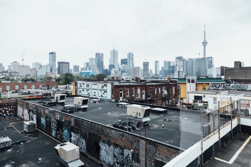 Free Image of Urban skyline with graffiti buildings 