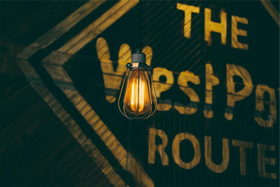Free Image of Vintage light bulb glowing in dark room 