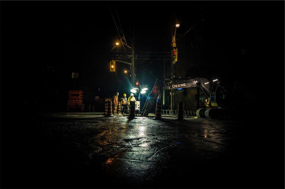 Free Image of Night construction scene with backhoe 