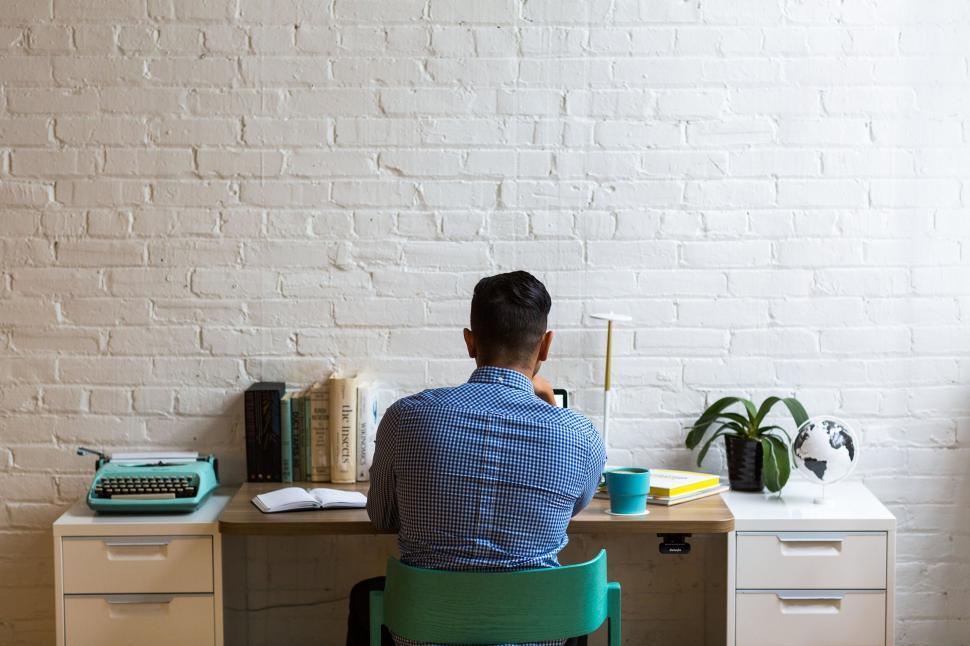 Free Image of Man Working in a Stylish Home Office 