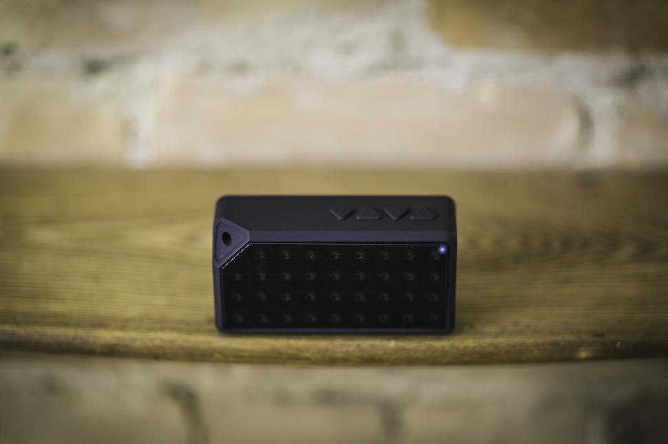 Free Image of Portable VAVA speaker on wooden surface 