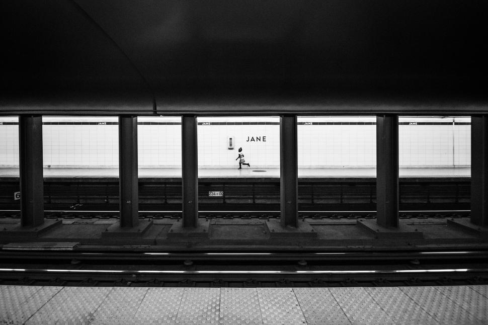 Free Image of Lone person waiting at Jane subway station 