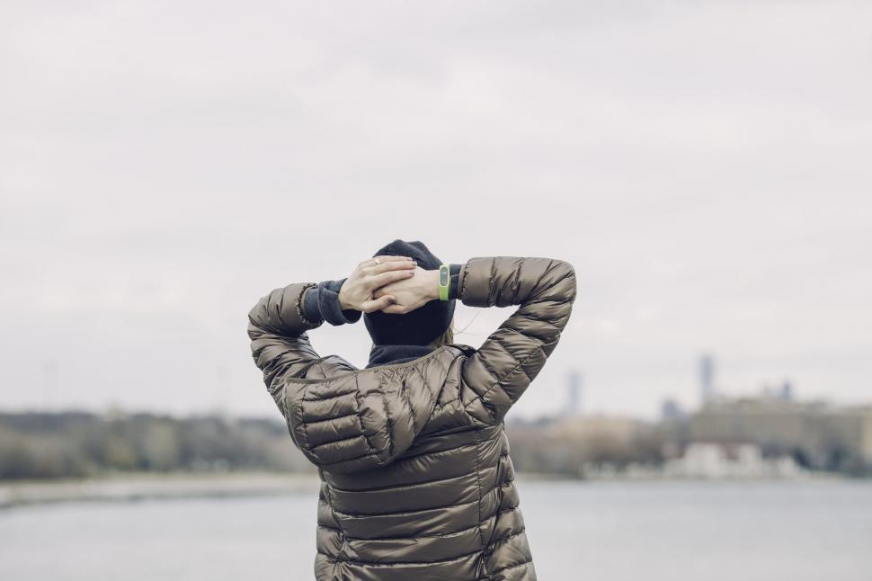 Free Image of Person in warm jacket enjoying the riverside 