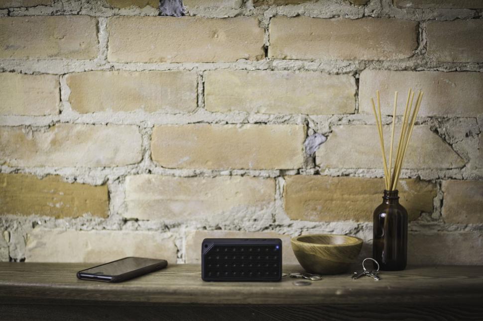 Free Image of Vintage shelf with assorted objects and brick wall 