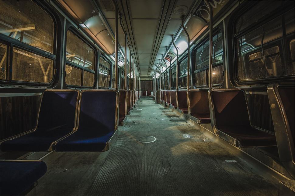 Free Image of Empty subway interior at night with eerie lights 