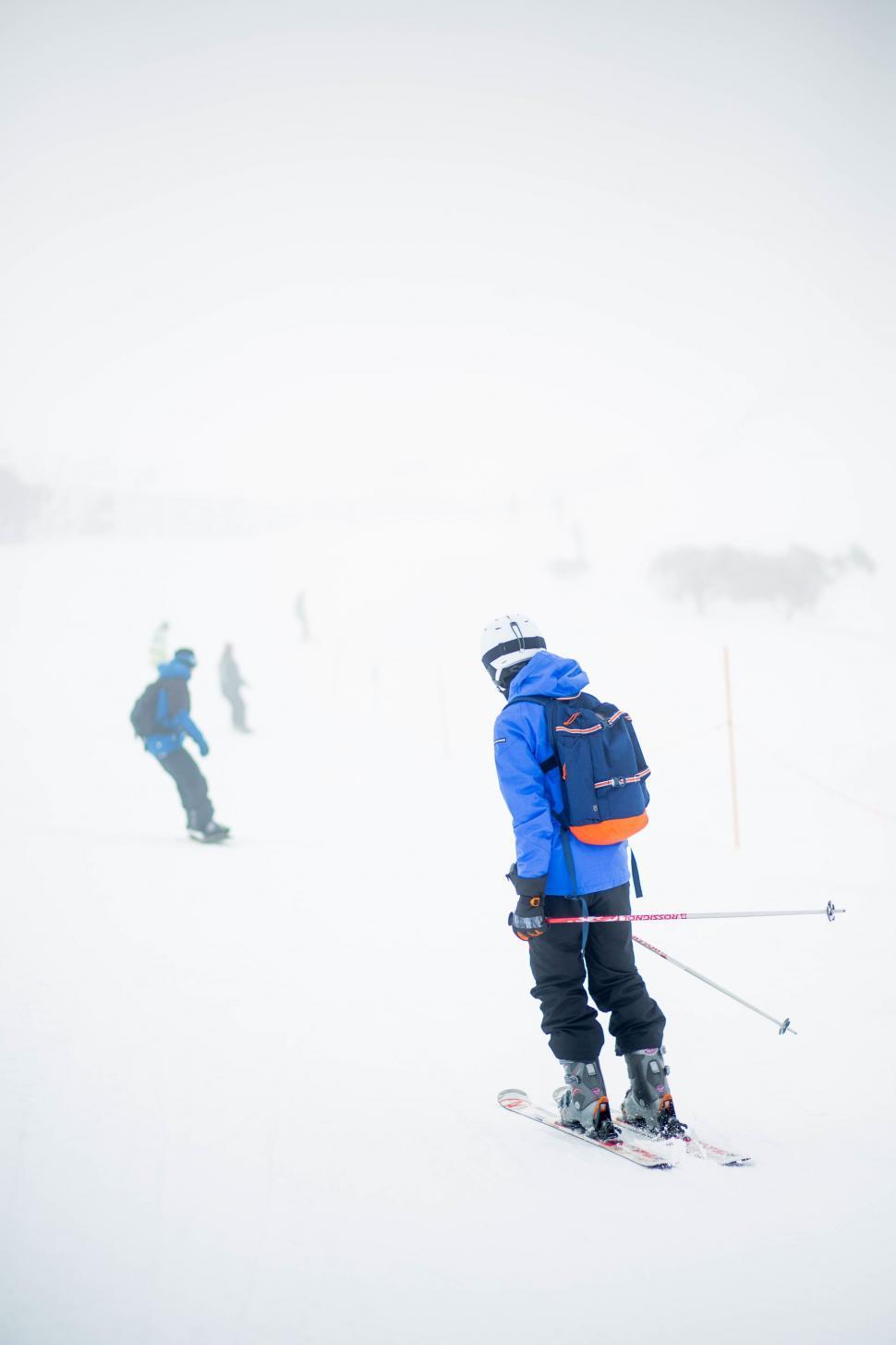 Free Image of Skier in blue on a snowy mountain slope 