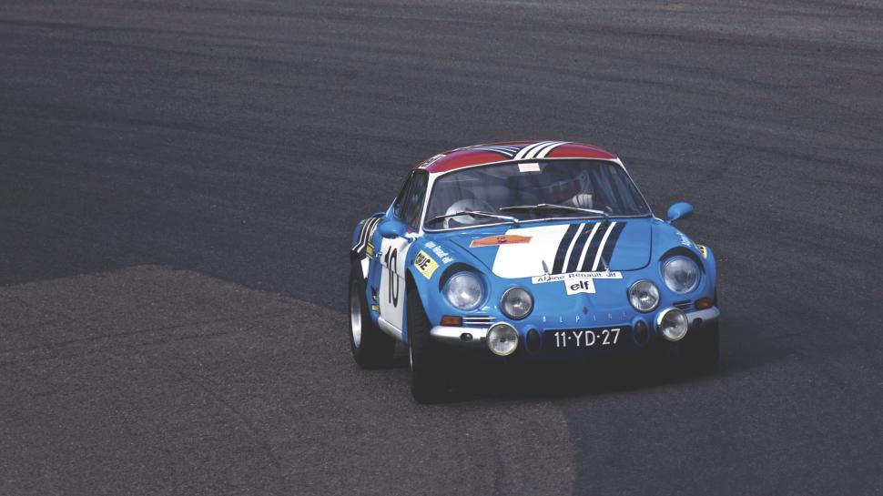 Free Image of Vintage racing car in dynamic action 