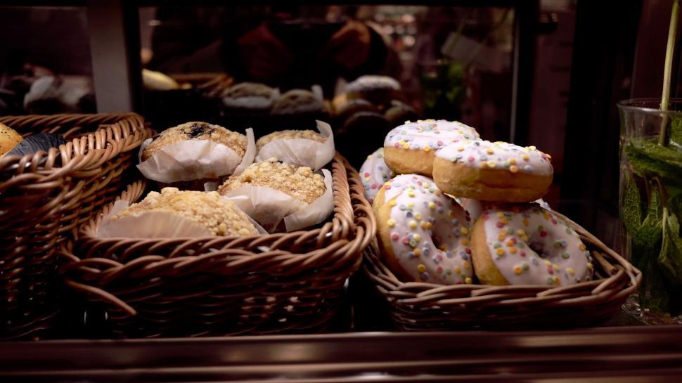 Free Image of Assortment of doughnuts in a bakery display 