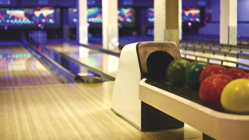Free Image of Indoor bowling alley ready for players 