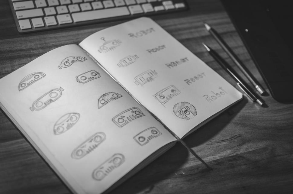 Free Image of Creative facial expressions sketches in notebook 
