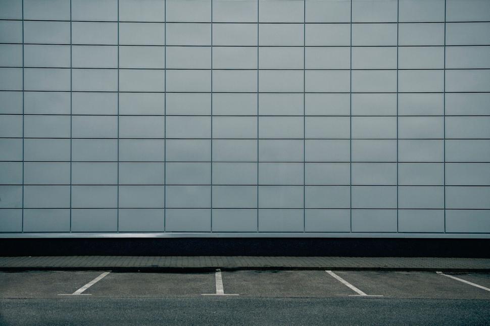 Free Image of Modern blue-tiled building facade with sky 