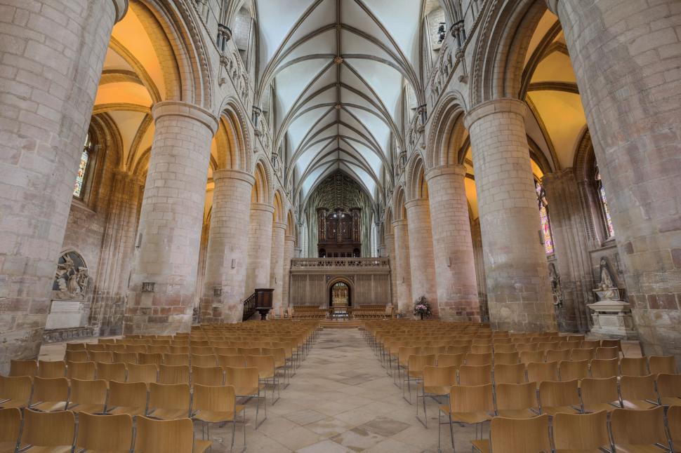 Free Image of Elegant church interior with rows of chairs 