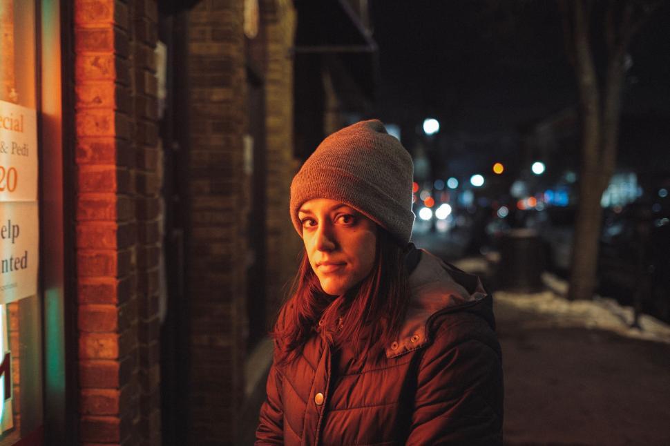 Free Image of Woman in beanie on a night street 