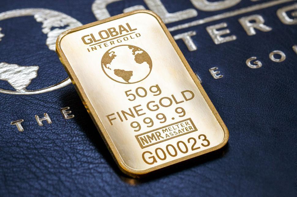 Free Image of Gold bar on blue leather texture 