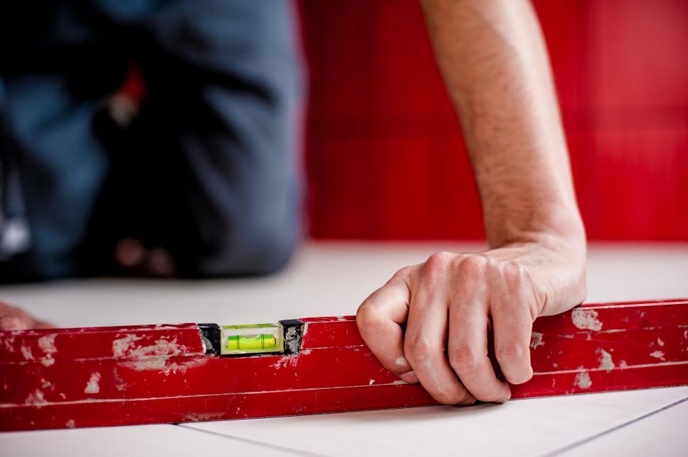 Free Image of Close-up of hand on spirit level tool 