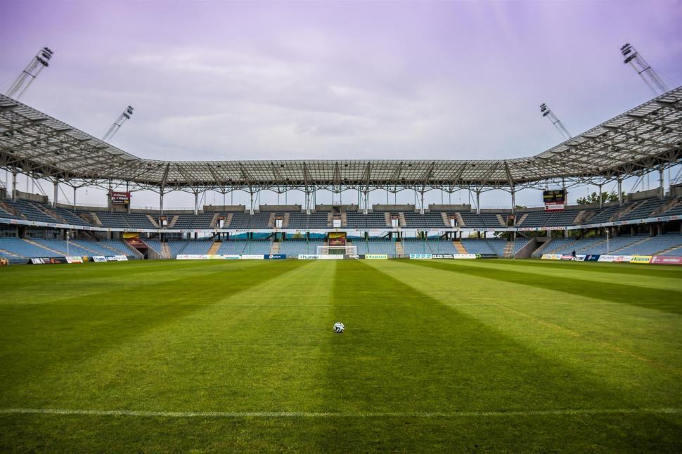 Free Image of Empty football stadium with green pitch 