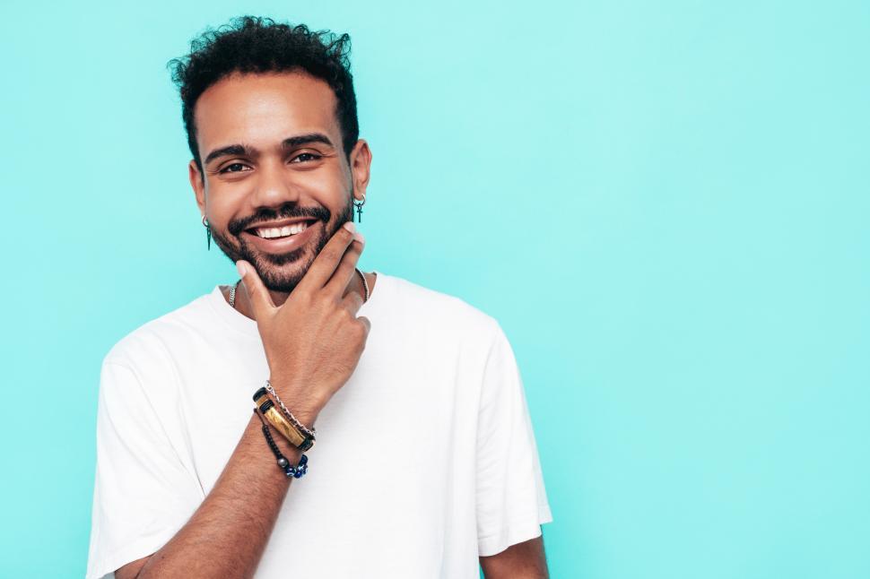 Free Image of A man with a hand on his chin 
