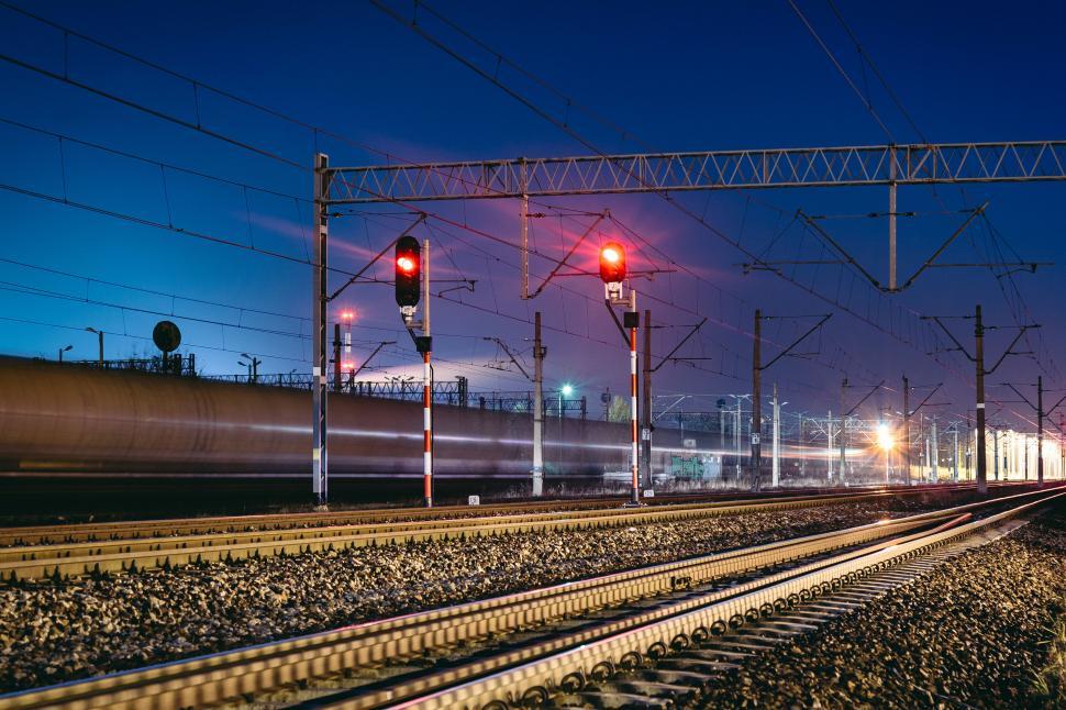 Free Image of Fast-moving train at a railway station 