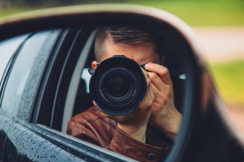 Free Image of Driver in car looking out the window 