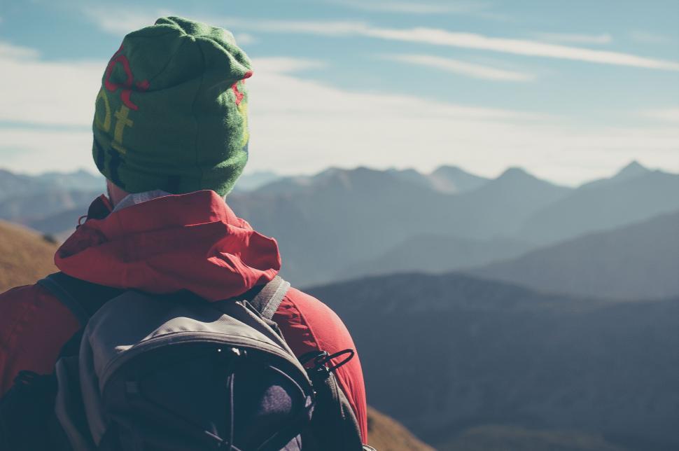 Free Image of Hiker observing mountain range panorama 