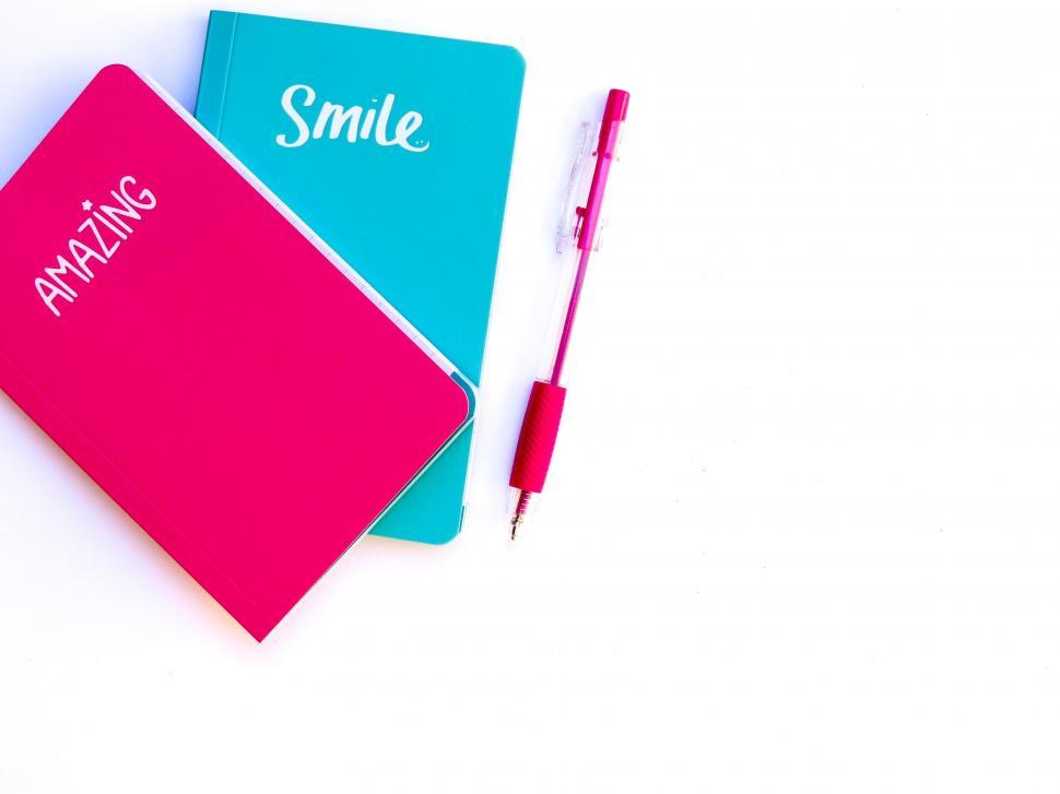 Free Image of Bright minimalist workspace with colorful notebooks 