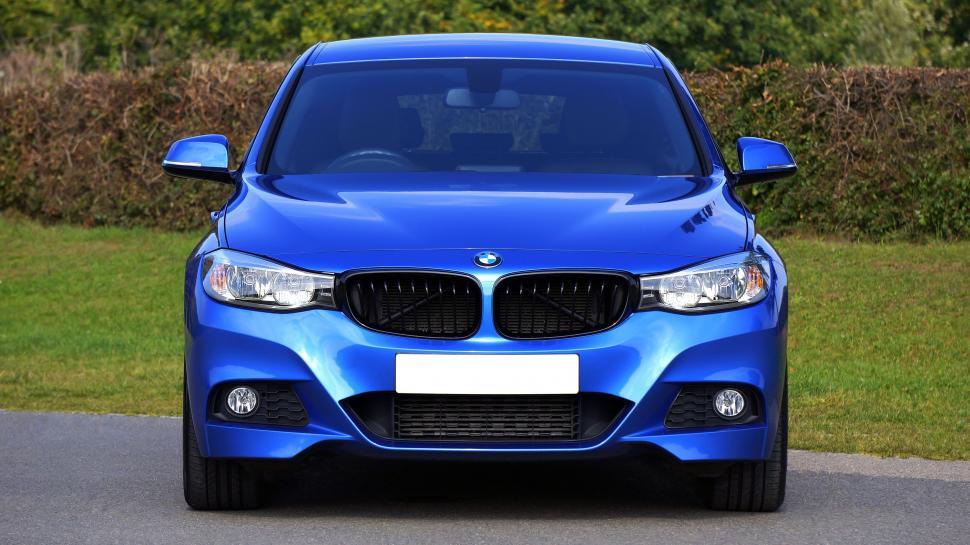 Free Image of Blue BMW car parked on the street 