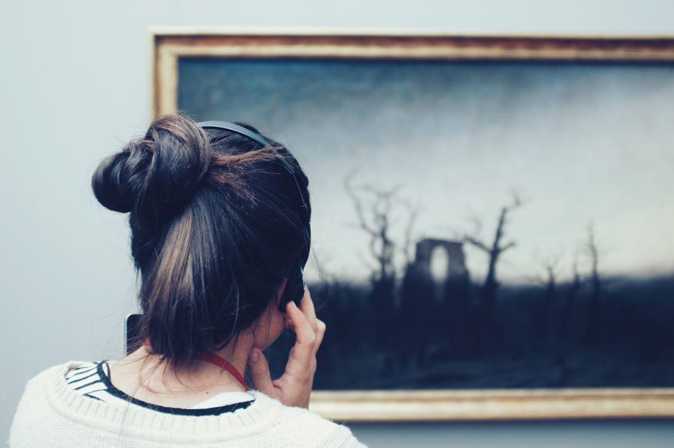 Free Image of Woman observing painting in art gallery 