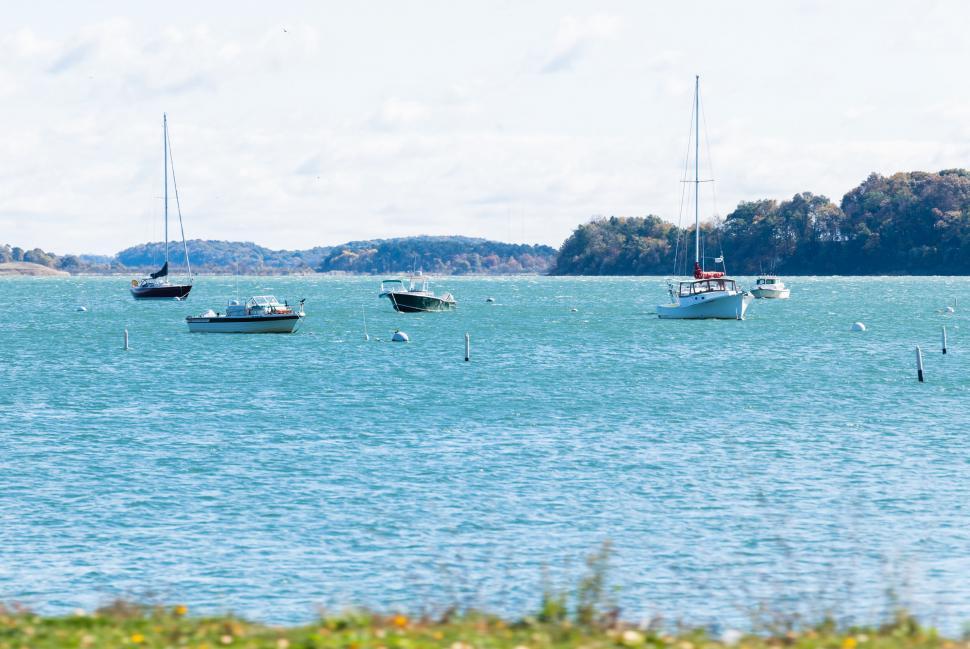 Free Image of Boats sailing on a serene lake 