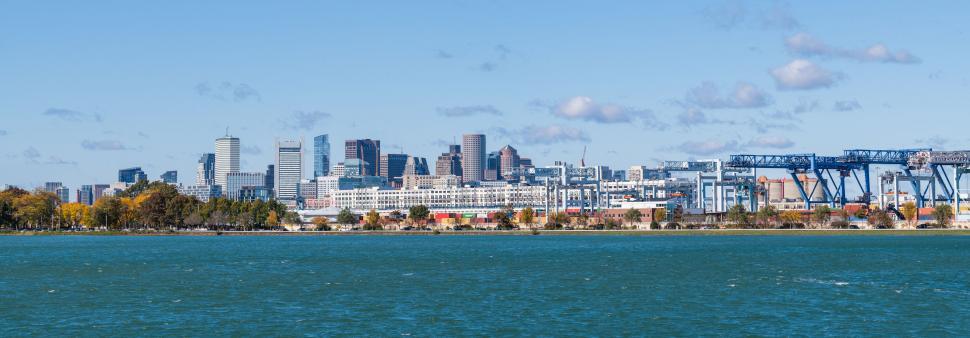 Free Image of Panoramic city skyline across a river 