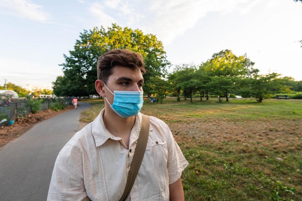 Free Image of Man with blurred face on a park path 