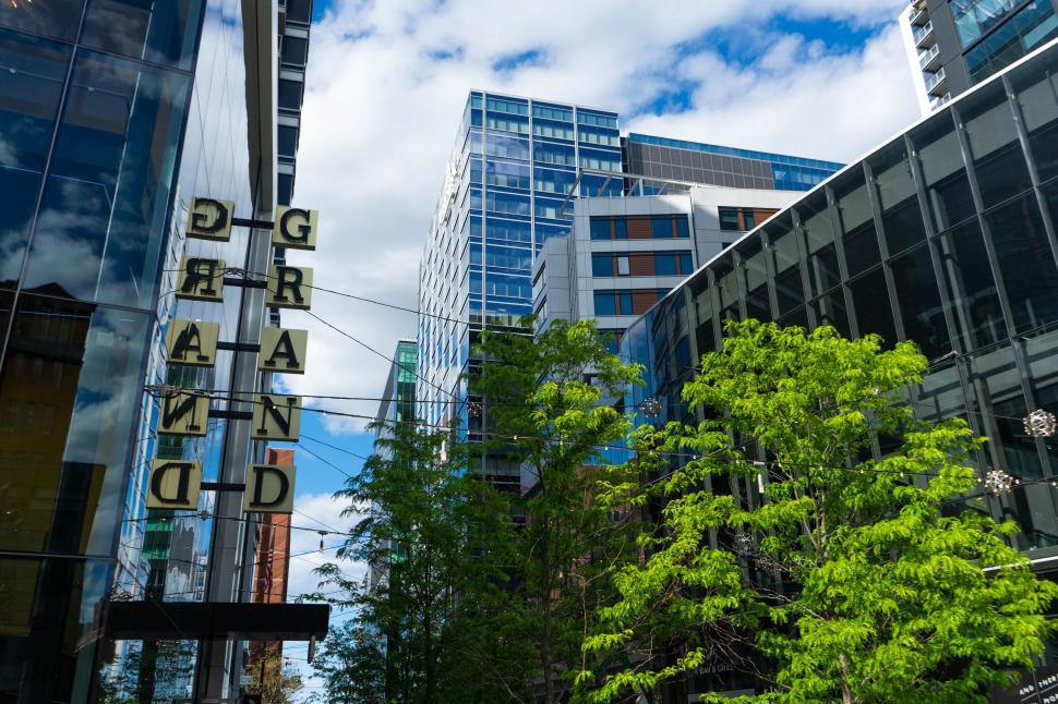 Free Image of Modern buildings behind a vintage sign 