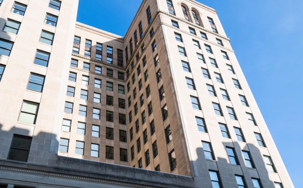 Free Image of Modern skyscraper exterior with blue sky 