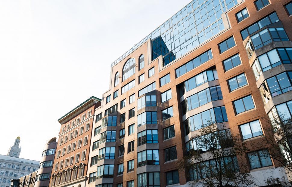 Free Image of Brown brick office building with glass windows 