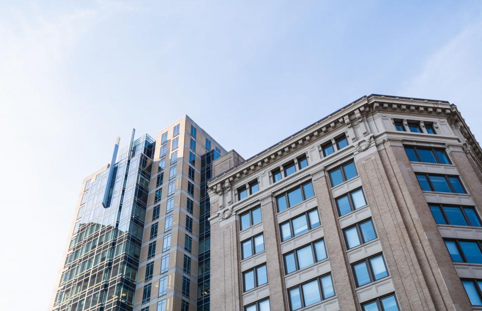 Free Image of Modern office buildings with clear sky backdrop 