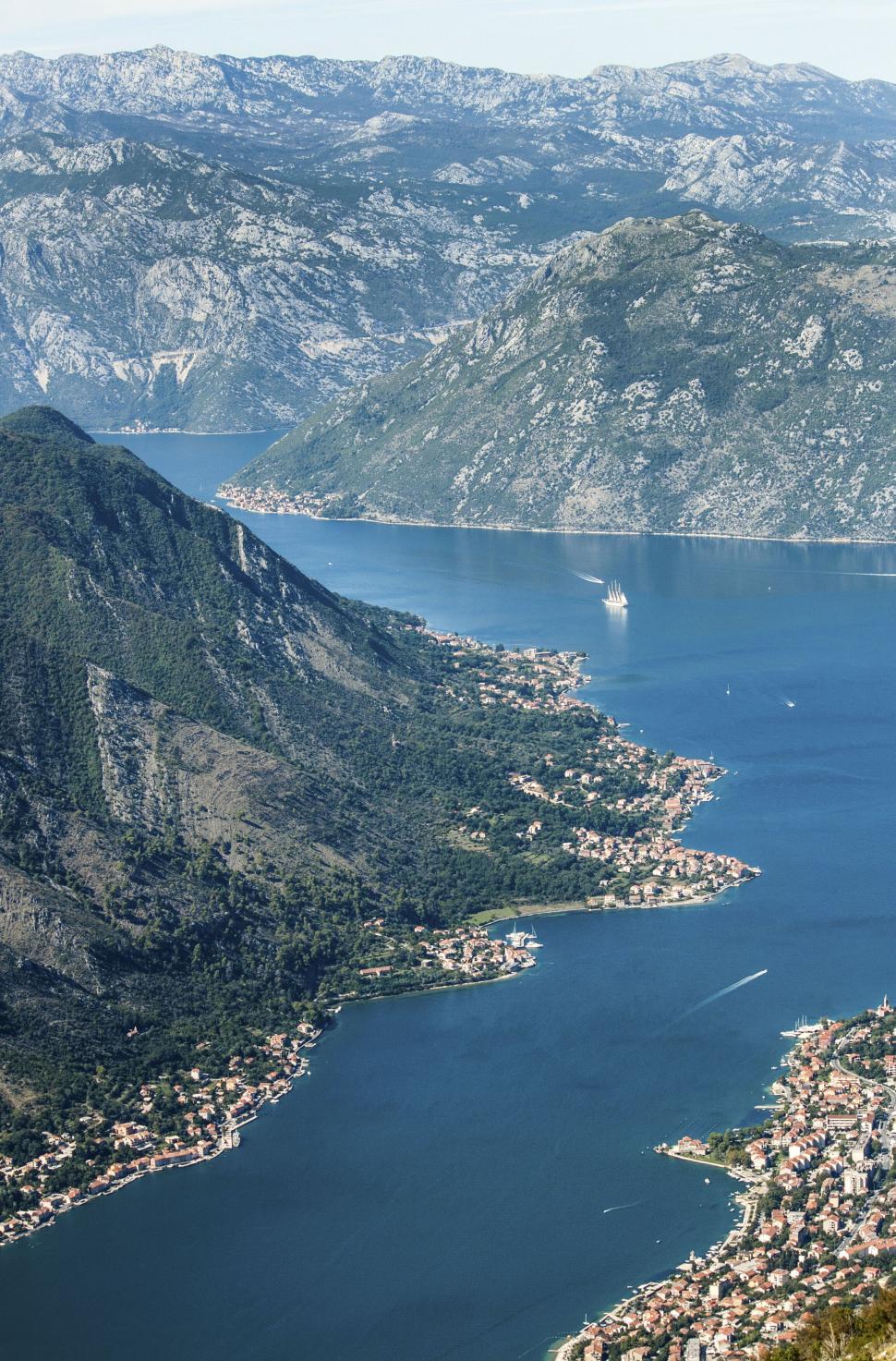 Free Image of Aerial view of coastal bay and mountains 