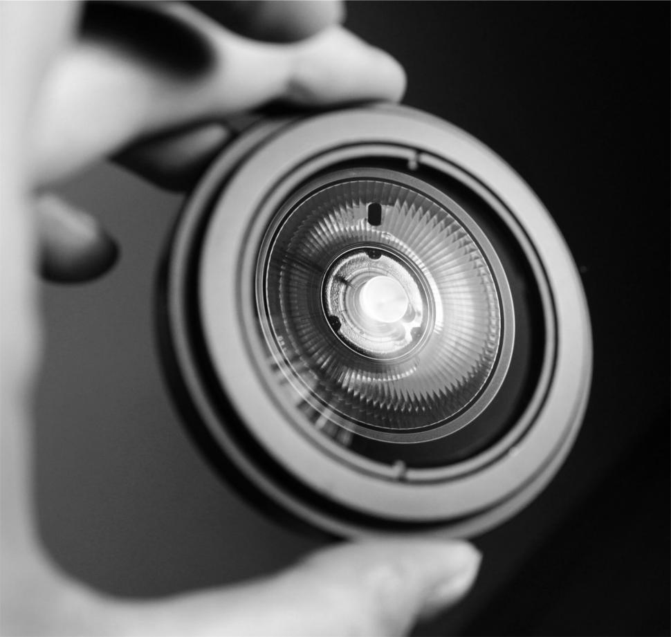 Free Image of Camera lens held up close 