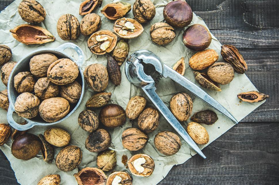 Free Image of Assortment of nuts with metal nutcracker 