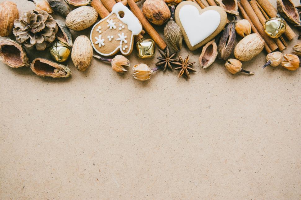 Free Image of Assorted nuts and spices on beige background 