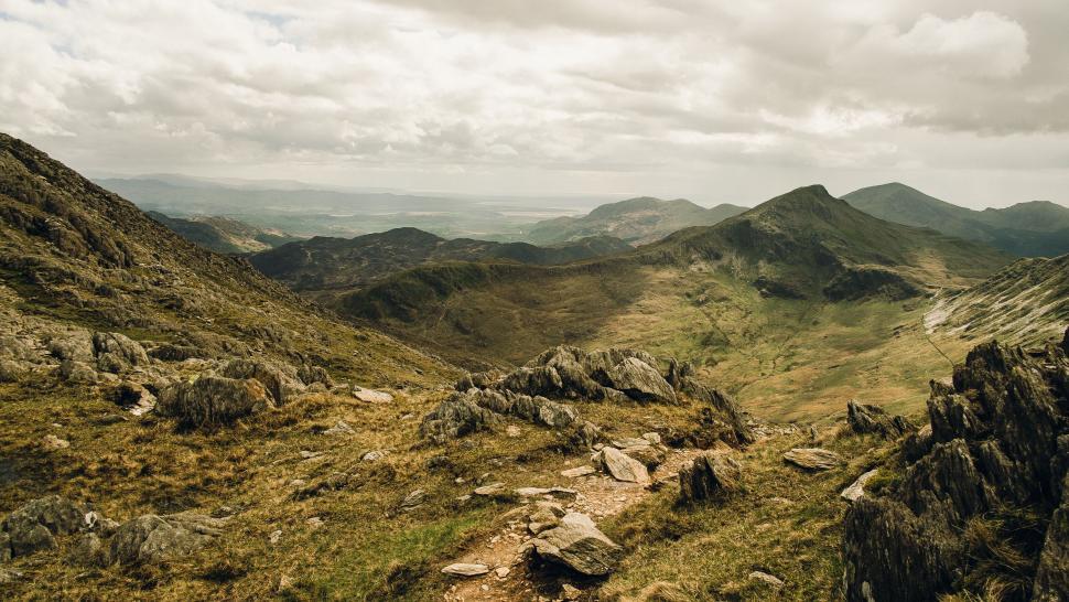 Free Image of Panoramic view of rugged mountain terrain 