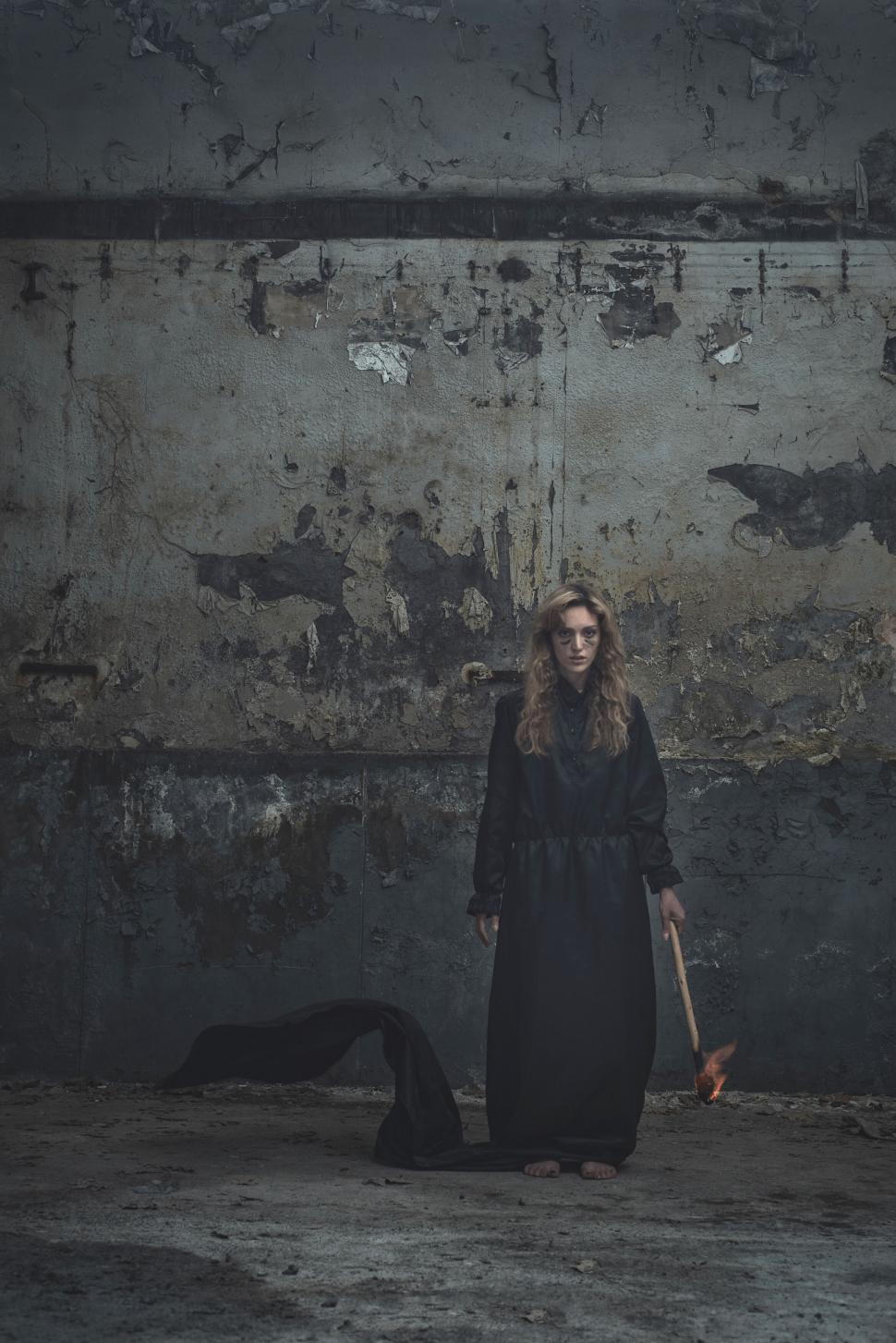 Free Image of Mysterious figure in black with axe 