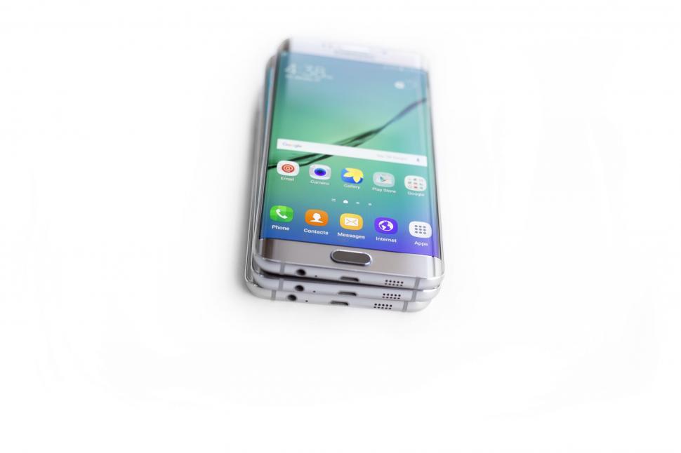 Free Image of Smartphone with colorful screen on white surface 