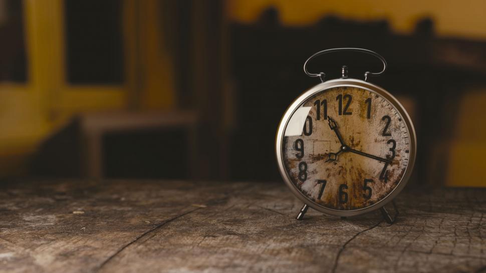 Free Image of Retro Alarm Clock on Vintage Table 