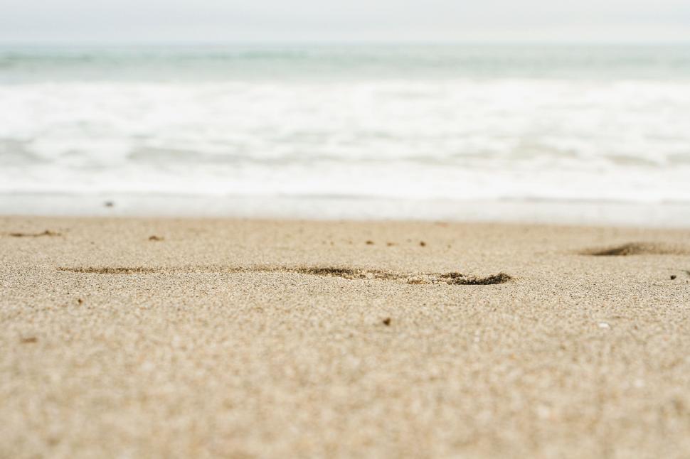 Free Image of Sandy beach with a clear horizon line 