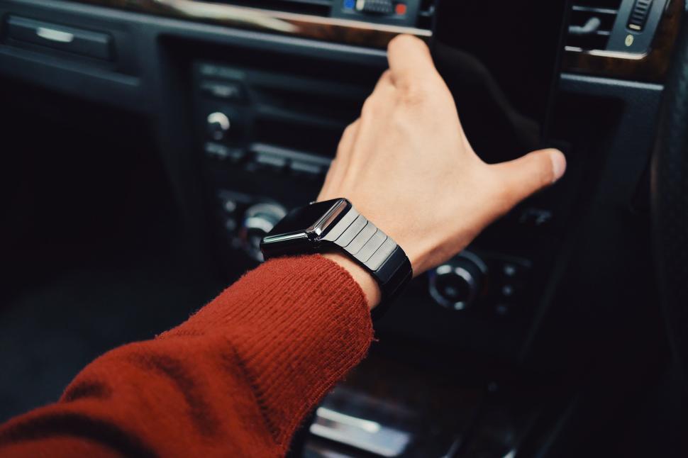 Free Image of Person adjusting car s infotainment system 