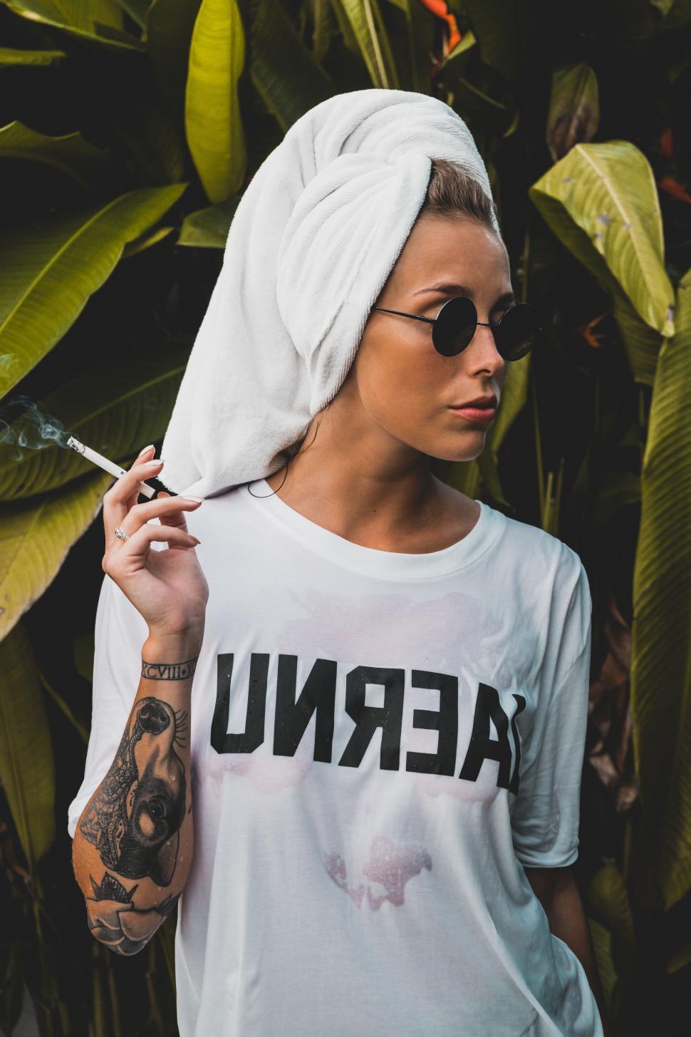 Free Image of Stylish woman with sunglasses and head towel 