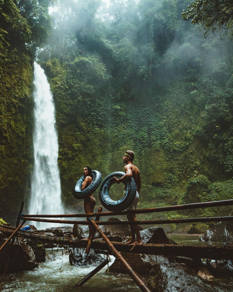 Free Image of Friends at a tropical waterfall adventure 