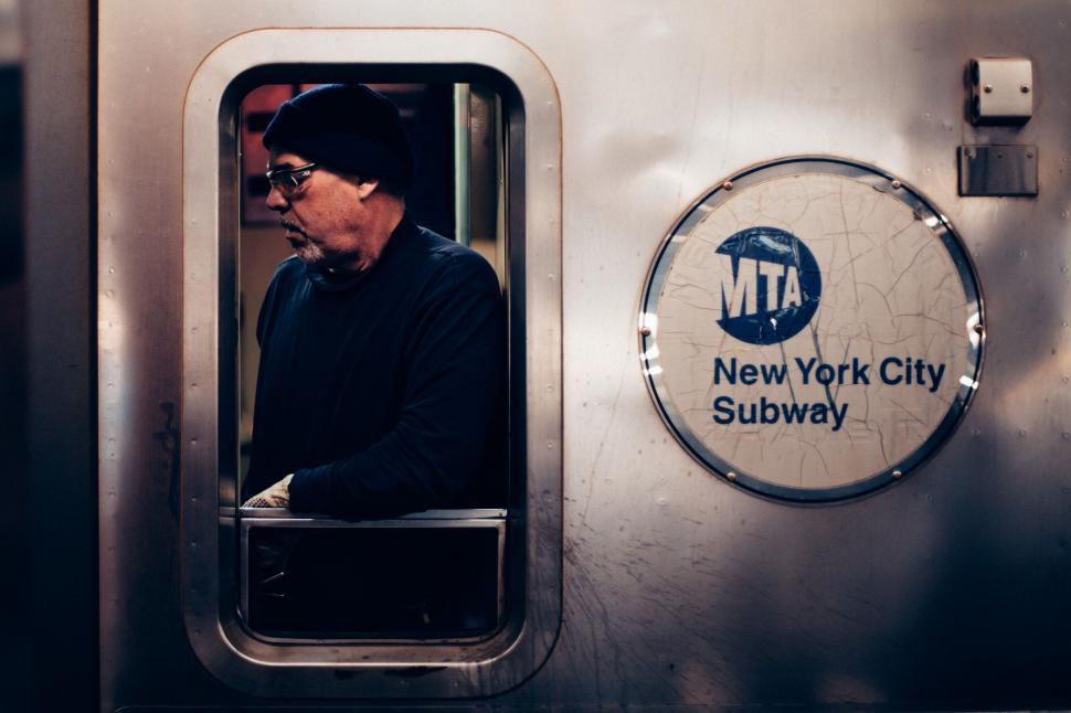 Free Image of Passenger in NYC subway train window 