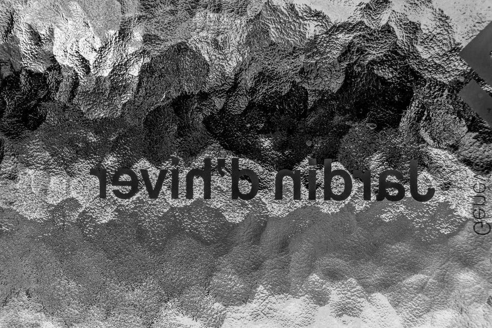 Free Image of Text reflection in rippled water closeup 